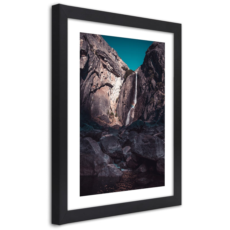 Picture in black frame, Waterfall among high rocks