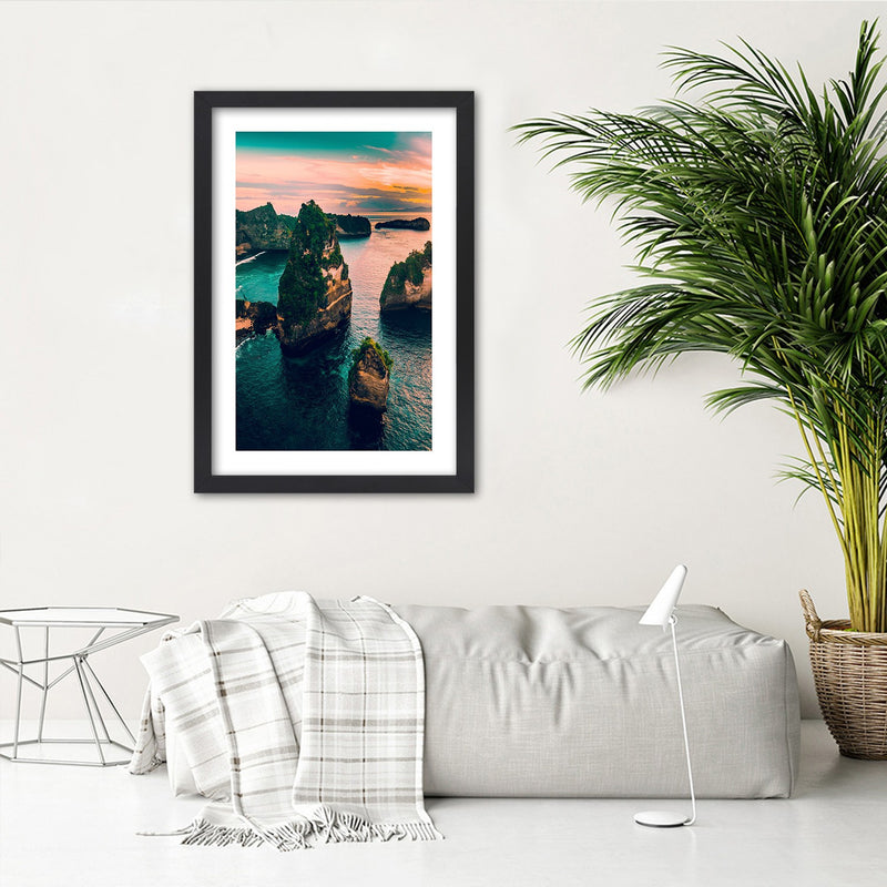 Picture in black frame, Rocks in the turquoise ocean