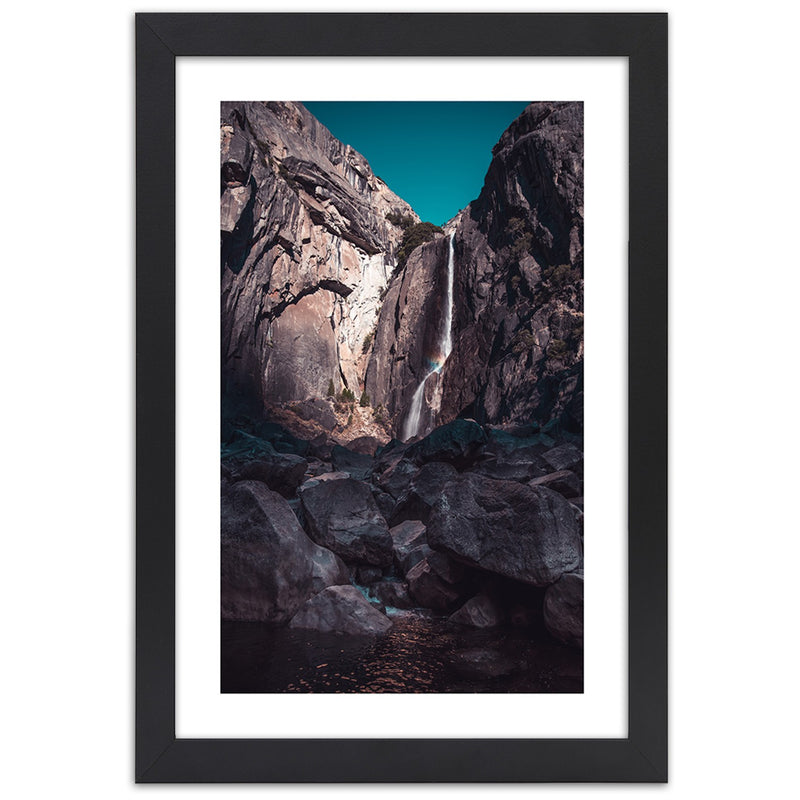 Picture in black frame, Waterfall among high rocks