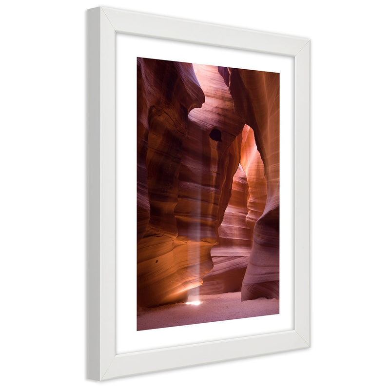 Picture in white frame, Sunrays in a cave