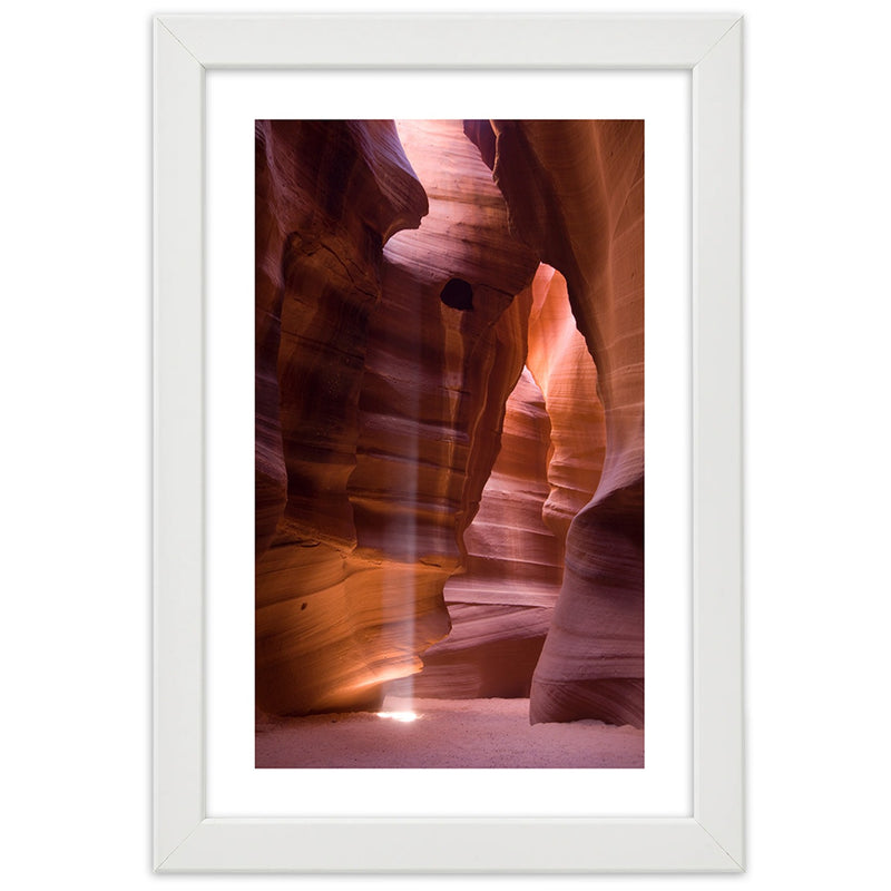 Picture in white frame, Sunrays in a cave