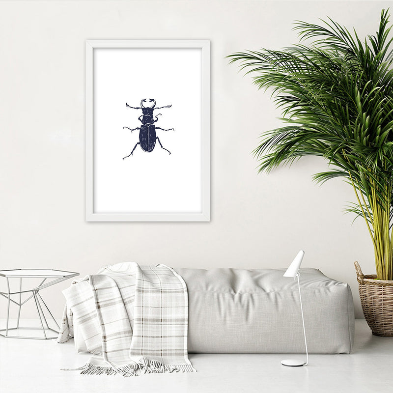 Picture in white frame, Black beetle